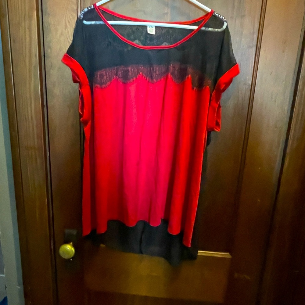 Red and black blouse. Sheer back, with lace trim.